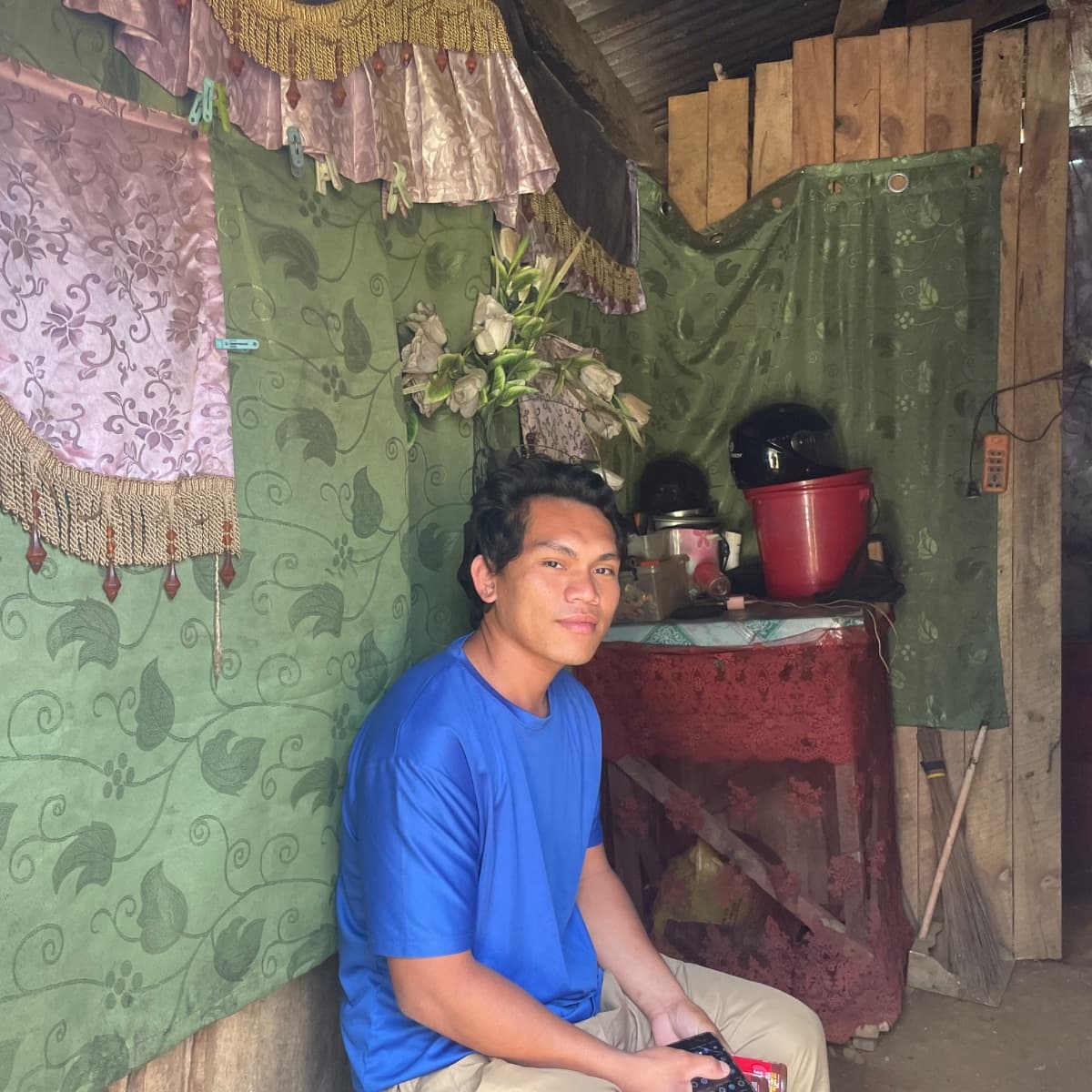 Mahid, 25, sits inside his home in Papandayan, Marawi City.